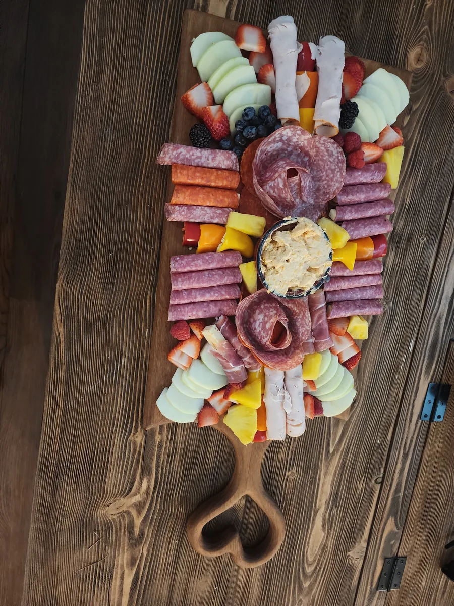 African teak heart charcuterie board in use